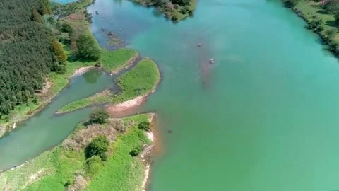 Aerial view of calm river and lush banks. Stock Footage 336319731