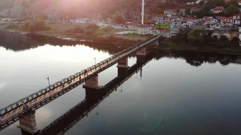 Aerial View Of Calm River With Bridge And Small Town Stock Footage 131587630