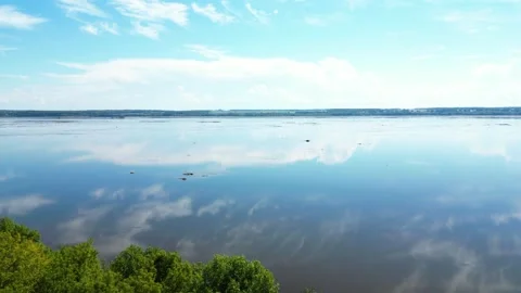 Aerial View of a Calm River Mirroring Clouds in Quebec Vídeos de archivo 338324914
