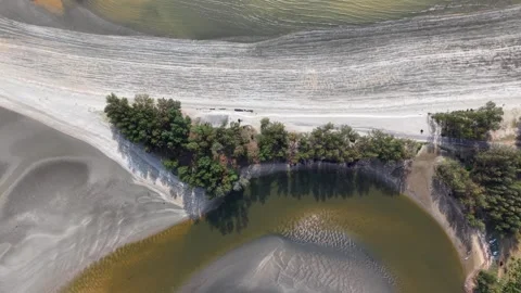 Aerial view of calm river winding through sandy banks Stock Footage 332608960