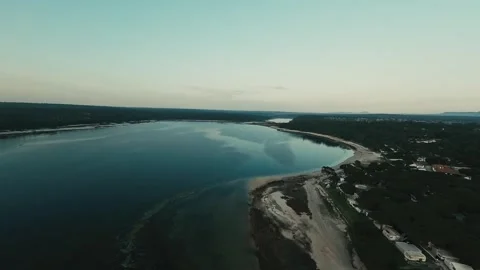 Aerial view of calm river winding through forested landscape Stock Footage 340227564