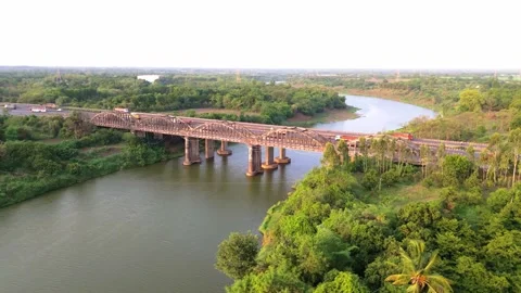 Aerial View Calm riverbed beneath clean expressway Stock Footage 312724267