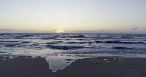 Aerial view calm sunset waves beach sand sea Stockbeeldmateriaal 232029191