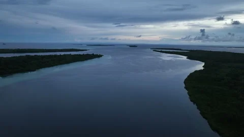 Aerial View of Calm Waters Between Cloud-Covered Islands in Melanesia Stock Footage 229656863
