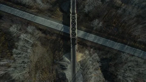 Aerial view (camera down) of the Railroad Bridge, Highway, Forest, in Late Fall Stock-Footage 165449497