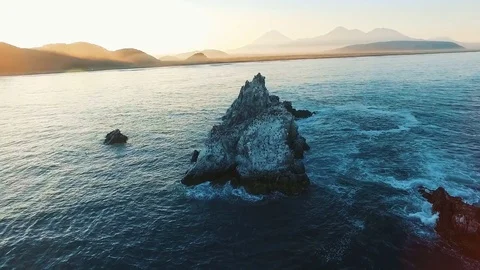 Aerial view. camera flies around the rocks in the sea Birds on the island Stock Footage 72744496