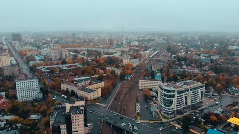 Aerial view camera flight above autumn city in foggy weather with many buildings Stock-Footage 117285211