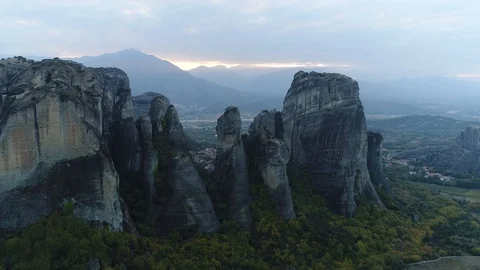 Aerial view. Camera moves at high altitude over high beautiful rocks. Stockbeeldmateriaal 98874443