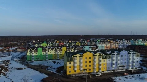 Aerial view. The camera moves over the roofs of colorful apartment houses. Stock Footage 93719381