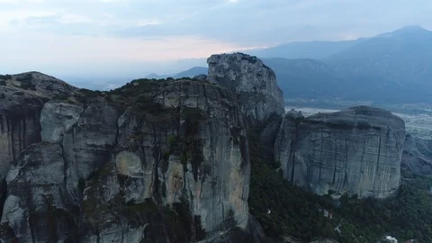 Aerial view. Camera moves  over high rocks and offers breathtaking view at city. Stock-Footage 98881516