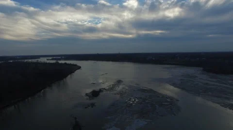 Aerial view, camera moving backwards over thawing river Stock Footage 60038447