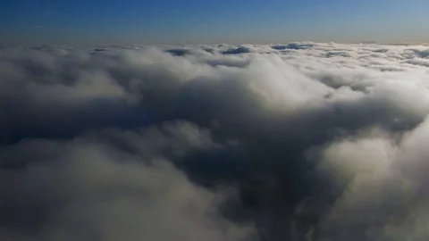 Aerial view camera moving inside clouds from above in sky space descending Stock Footage 93219098