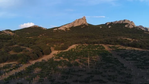  Aerial view. The camera rises over picturesque rocky ledges of ridges at sunset 스톡 동영상 93691490