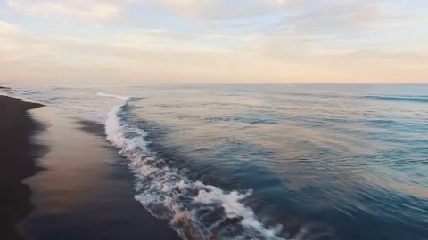 Aerial view. Camera twirled sea. Sun at sunset shining into the camera Stock Footage 72737268