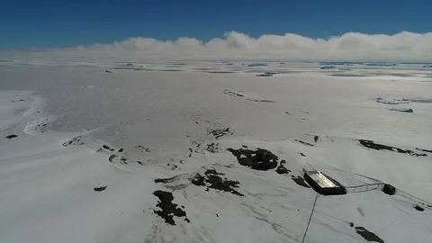 Aerial view.the camera/drone flies over the ice of Antarctica. wintering station Stock Footage 119577192
