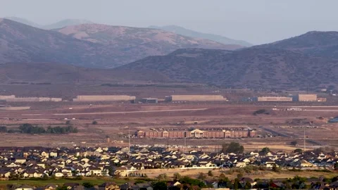 Aerial View of Camp Williams and NSA Data Center in Hazy Lehi Utah Landscape Stock Footage 337938676