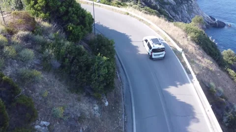 Aerial view camper van with solar panel on panoramic road, Elba, Italy Видео 336331617