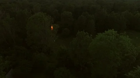Aerial view of a campfire in the forest at sunset in Estonia. Stock Footage 90696081