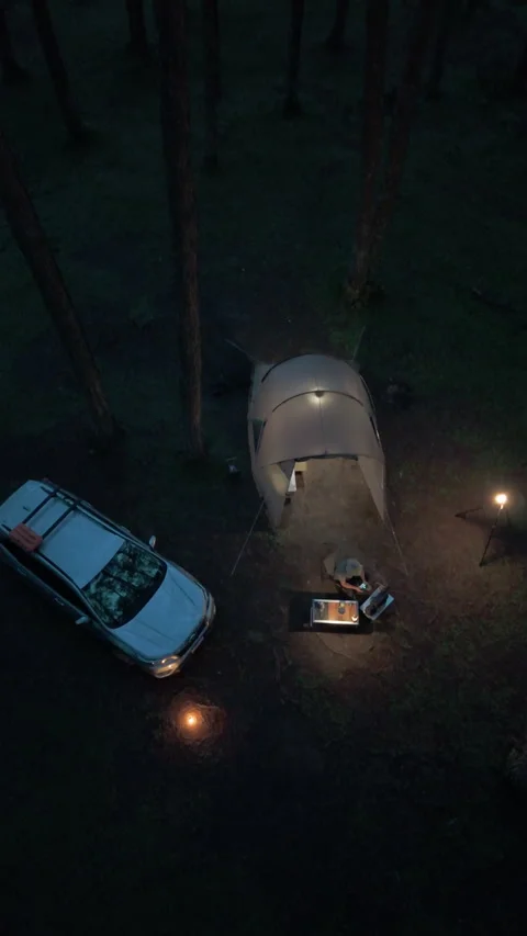 Aerial view, camping alone in the pine forest with SUV car in evening Video stock 289315067