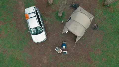 Aerial view, camping alone in the pine forest with SUV car Stock Footage 289326275
