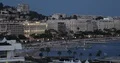 Aerial View of Cannes City Skyline People Walk on French Riviera Promenade Dusk 4k or 4k+ Resolution