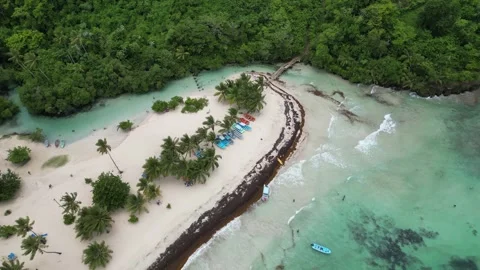 Aerial view of the Caño Frío river mouth at the idyllic Playa Rincón beach near Stock Footage 299568647