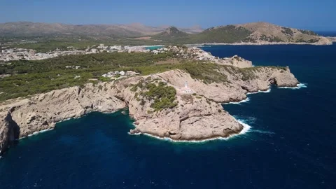 Aerial view of Capdepera Lighthouse on rugged Coastline, Mallorca Stock Footage 284875592