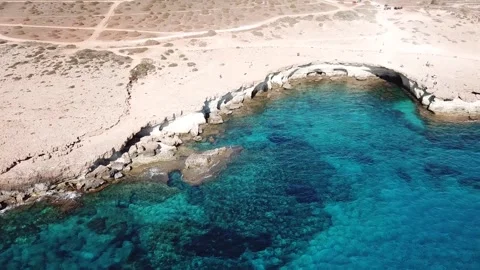 Aerial view Cape Cavo Greco. Bright sky and crystal water. Stock Footage 321435944