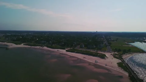 Aerial view of Cape Charles, breakwater jetty, and coastal town in Virginia Stock Footage 344764232