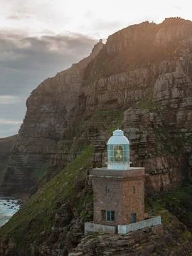 Aerial view of Cape Point lighthouse on rugged cliff near Cape Town 스톡 사진
