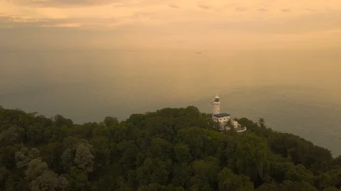 Aerial view of Cape Rachado Lighthouse with trees,Port Dickson,Malaysia Stock Footage 112616288