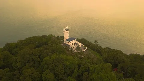 Aerial view of Cape Rachado Lighthouse with trees,Port Dickson,Malaysia Stock Footage 112616298