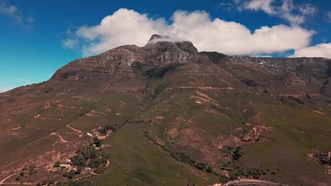 Aerial view of Cape Town suburb with Table Mountain and clouds Stock Footage 332334993