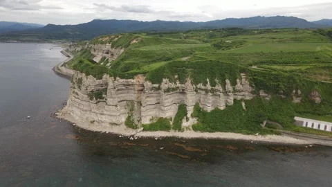 Aerial view of a cape on a white columnar cliff Stock Footage 159106554