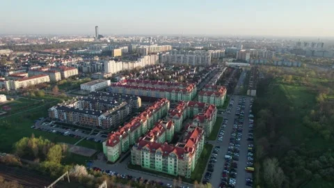 An aerial view captured by a drone, flying over residential houses at sunri.. Stock-Footage 239514328