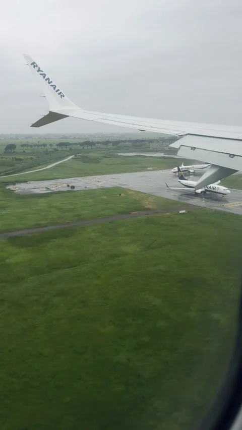 Aerial view captured from a Ryanair plane during final approach to Pisa Airport Stock Footage 308241523