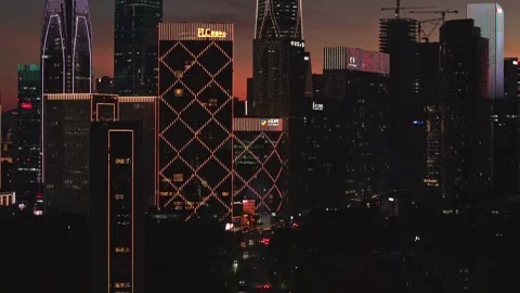 Aerial view captures bright city lights illuminate the skyscrapers of Hangzhou Stock Footage 344880288