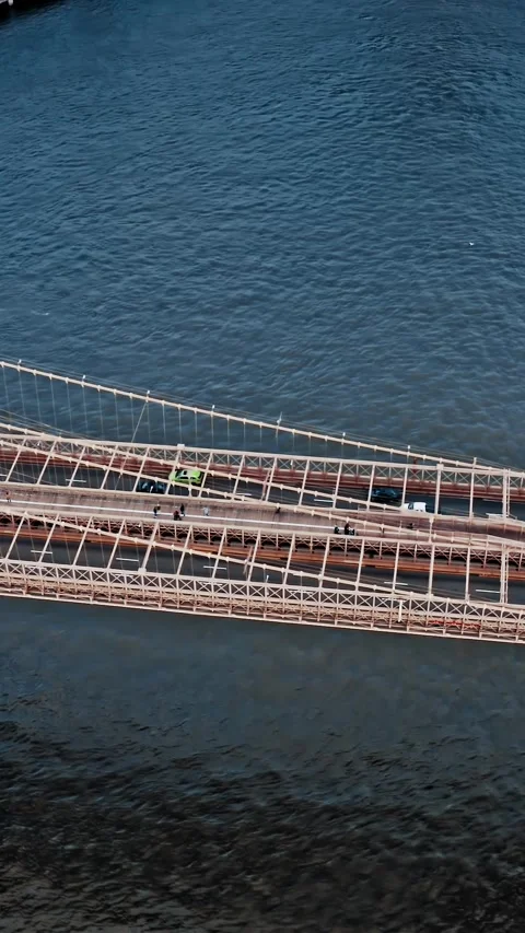 Aerial view captures Brooklyn Bridge over water in New York City Stock Footage 304281049