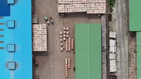 An aerial view captures a bustling industrial complex with a diverse array of 動画素材 338375665