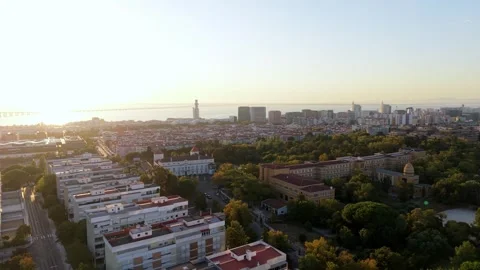 Aerial view captures city during sunrise; Portela de Sacavem Видео 346118866