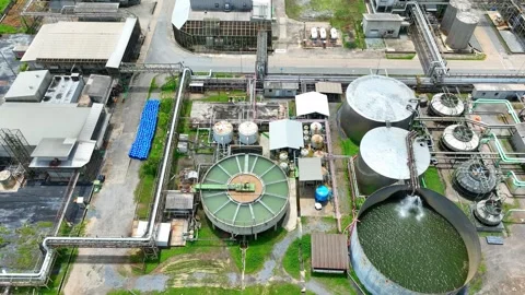 Aerial view captures a complex industrial factory with tanks. Vídeo Stock 344972987
