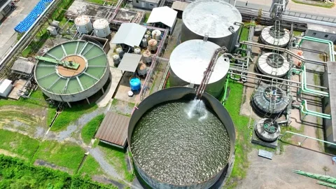 Aerial view captures a complex industrial factory with tanks. Vídeo Stock 344973032