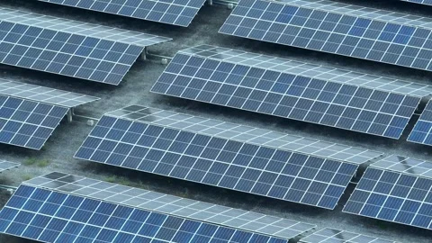 An aerial view captures a large array of solar panels. Stock Footage 306734838