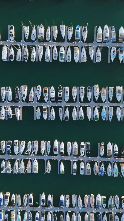An Aerial View that Captures the Scene of a Bustling Marina Filled with Many Stock Footage 315318508