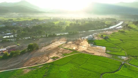 Aerial view captures severe flash flood damage across rice fields. Stock Footage 347275551