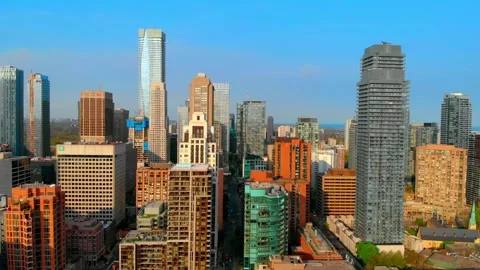 Aerial view capturing expansive metropolitan landscape with gleaming modern Stock Footage 307553903