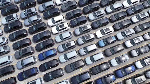 An Aerial View Capturing a Large Array of Parked Cars in a Busy Commercial Stock Footage 318330116
