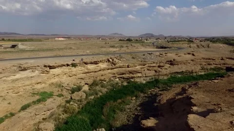 Aerial view capturing a peaceful stream winding through, stock footage. Stock Footage 304796162