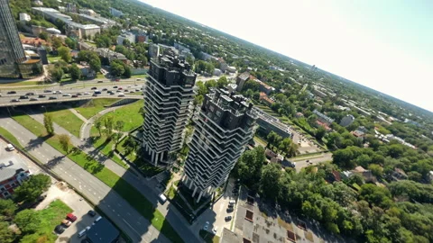 Aerial view capturing towering skyscrapers rising above urban landscape Stock Footage 306388070