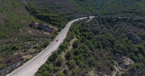 Aerial view of car driving down country road Stock Footage 97925800